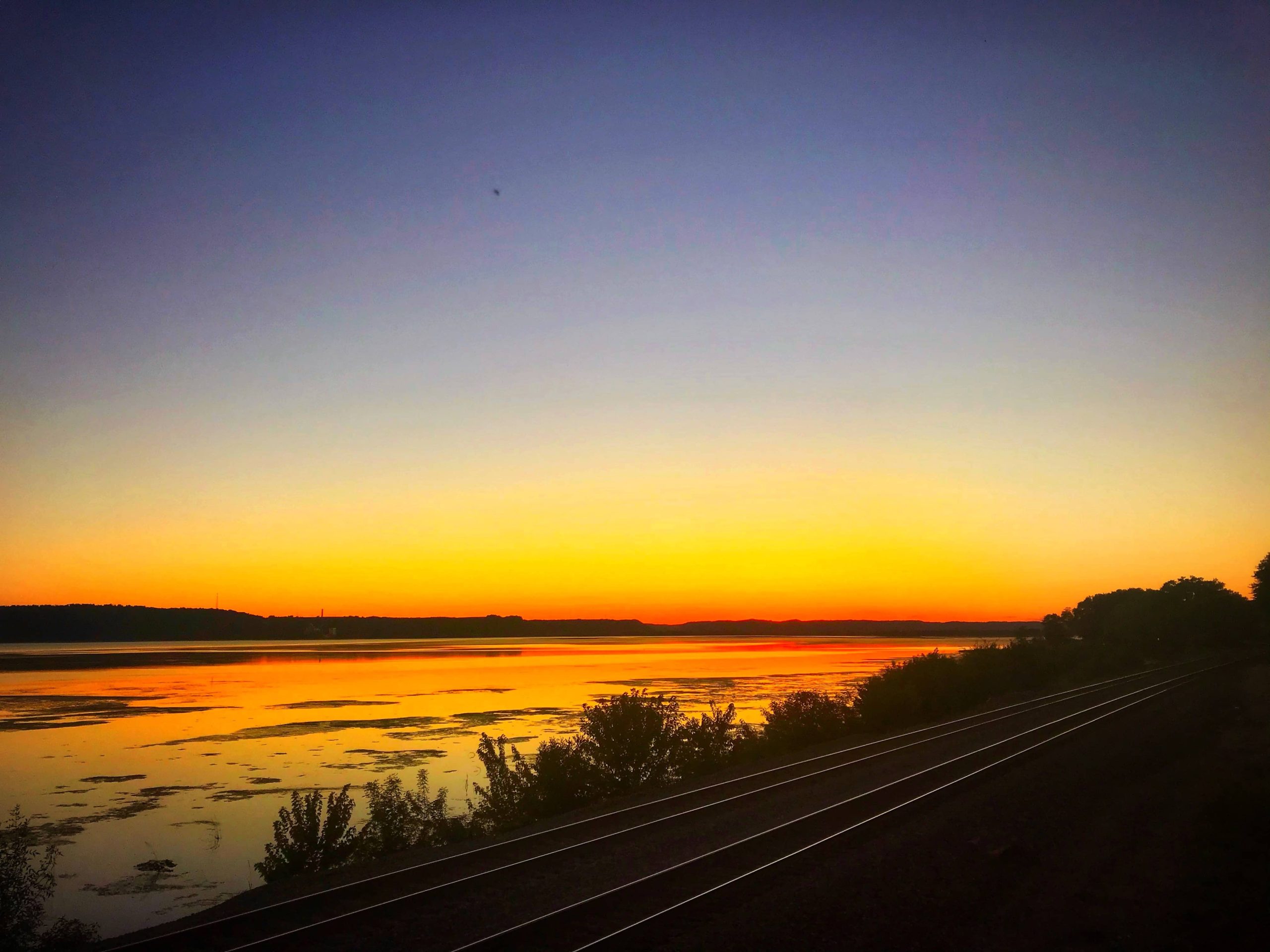 sunset over mississippi river in ferryville wisconsin on the great river road