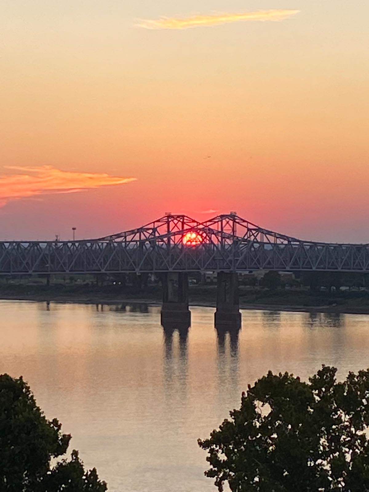 Sunset over twin Mississippi River bridges in Natchez, Mississippi