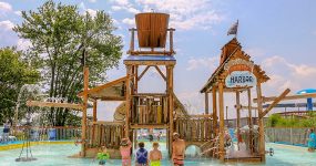 Children standing outside waterpark along the Great River Road in Illinois